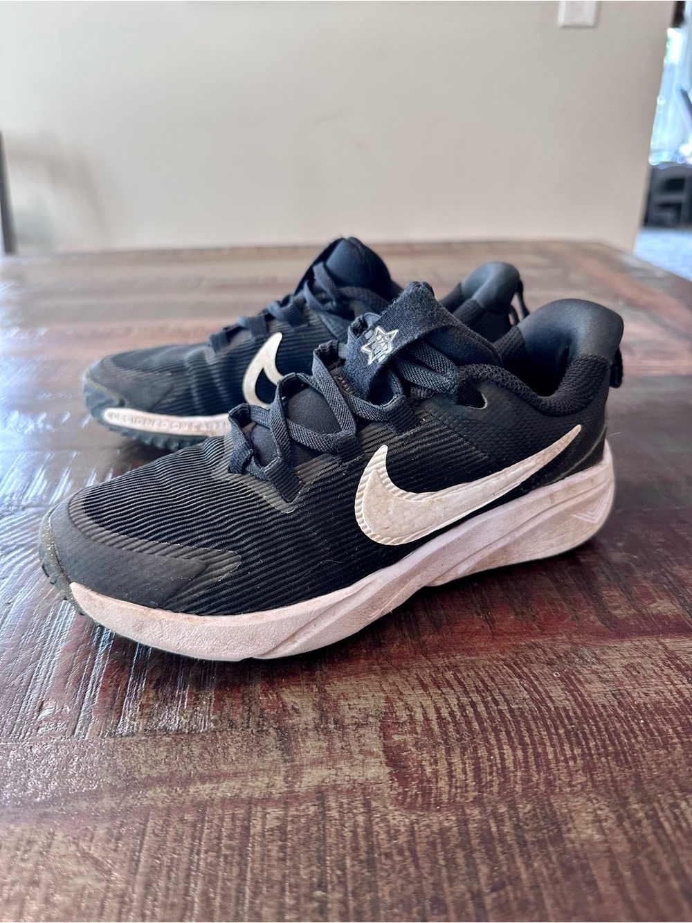 Nike Kids Black Sneakers with White Swoosh